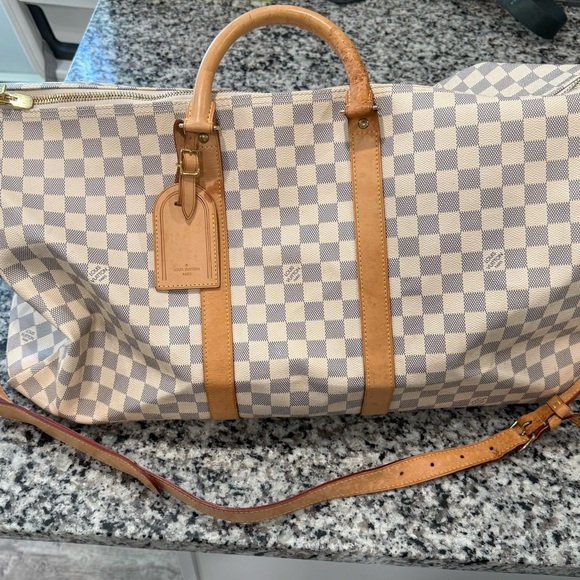 Louis Vuitton duffle bag, two of the straps are damaged as shown in pictures. - Picture 9 of 15